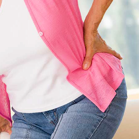 Woman suffering with hip pain in need of chiropractic care in San Rafael